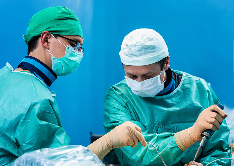 neurosurgeon dr. neil cochrane performing spine surgery